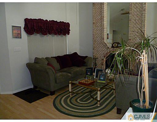 116 Almond Road Freehold, NJ 07728 - Photo 3 of 14 a view of a livingroom with furniture and a couch