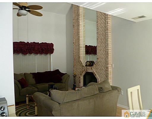 116 Almond Road Freehold, NJ 07728 - Photo 4 of 14 a living room with furniture and a shower
