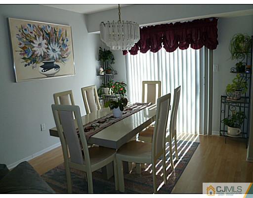 116 Almond Road Freehold, NJ 07728 - Photo 5 of 14 a view of a dining room with furniture window and wooden floor