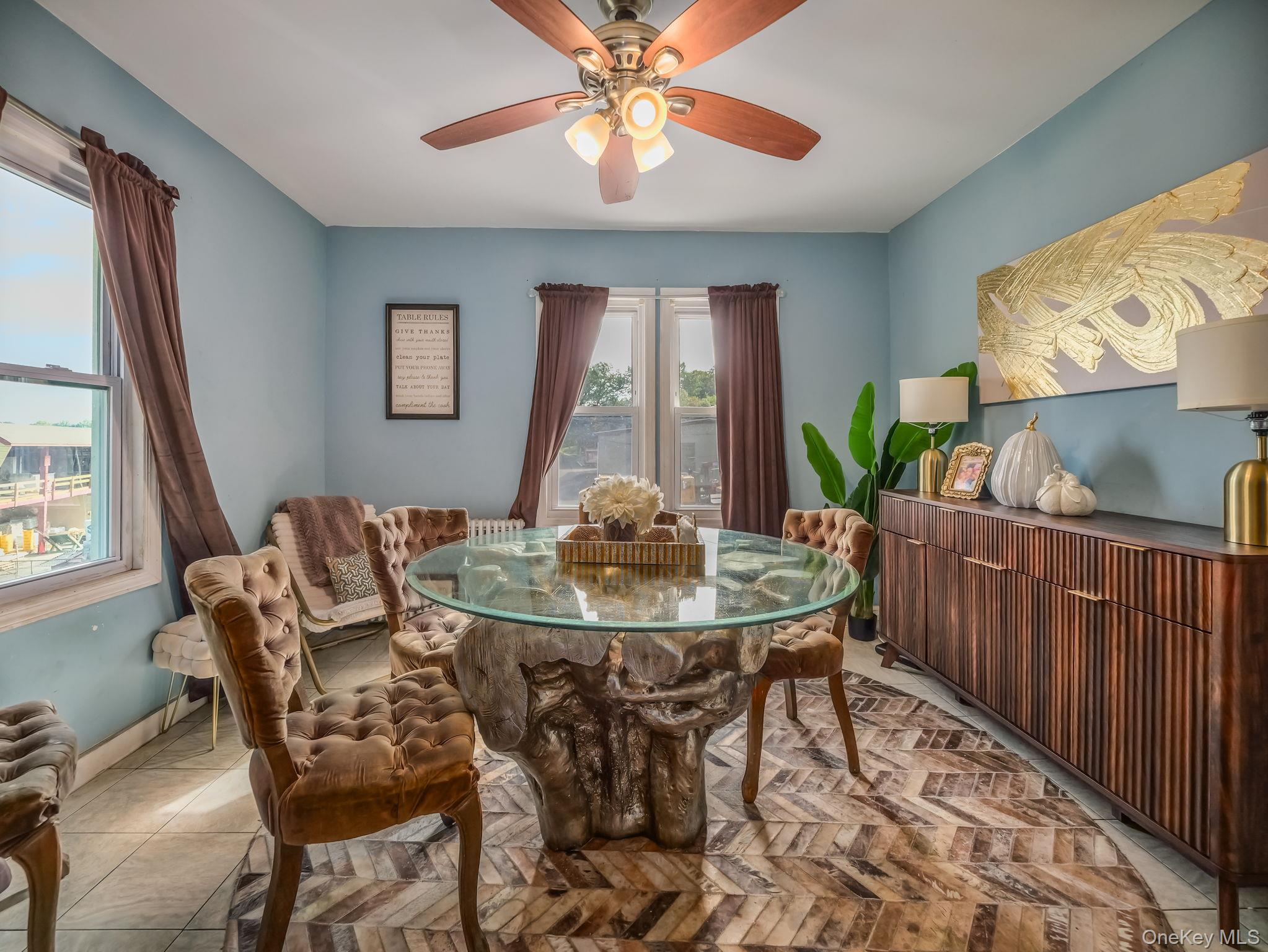 3 South Myrtle Avenue Spring Valley, NY 10977 - Photo 11 of 40 Tiled dining area with ceiling fan and baseboards