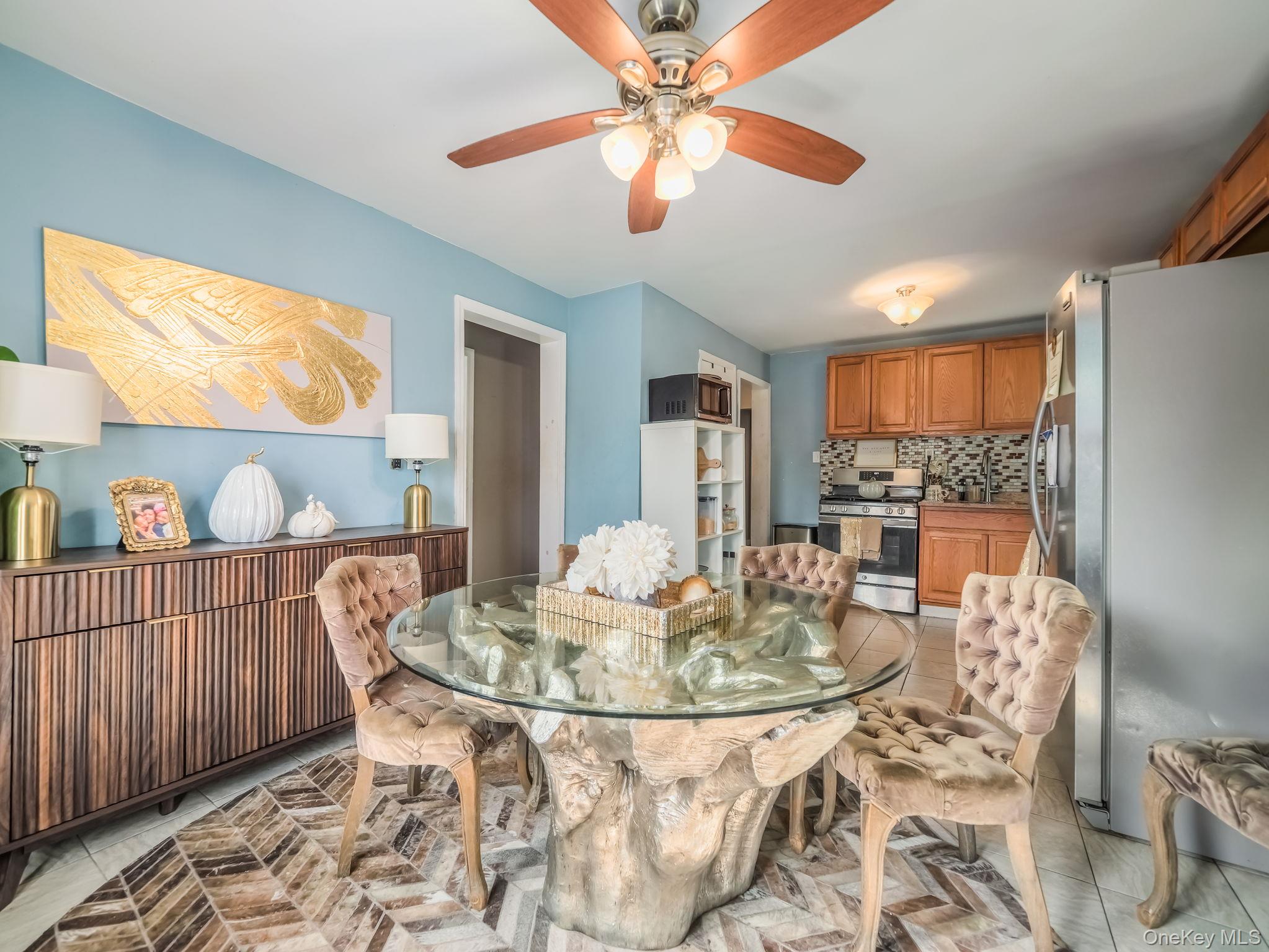 3 South Myrtle Avenue Spring Valley, NY 10977 - Photo 12 of 40 Dining room with light tile patterned floors and ceiling fan
