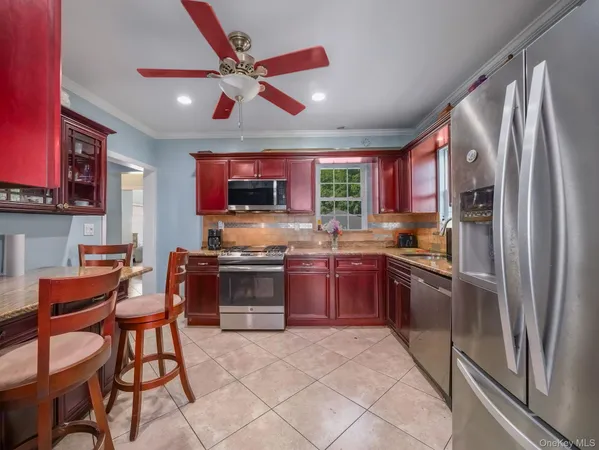 a kitchen with a stove sink and microwave