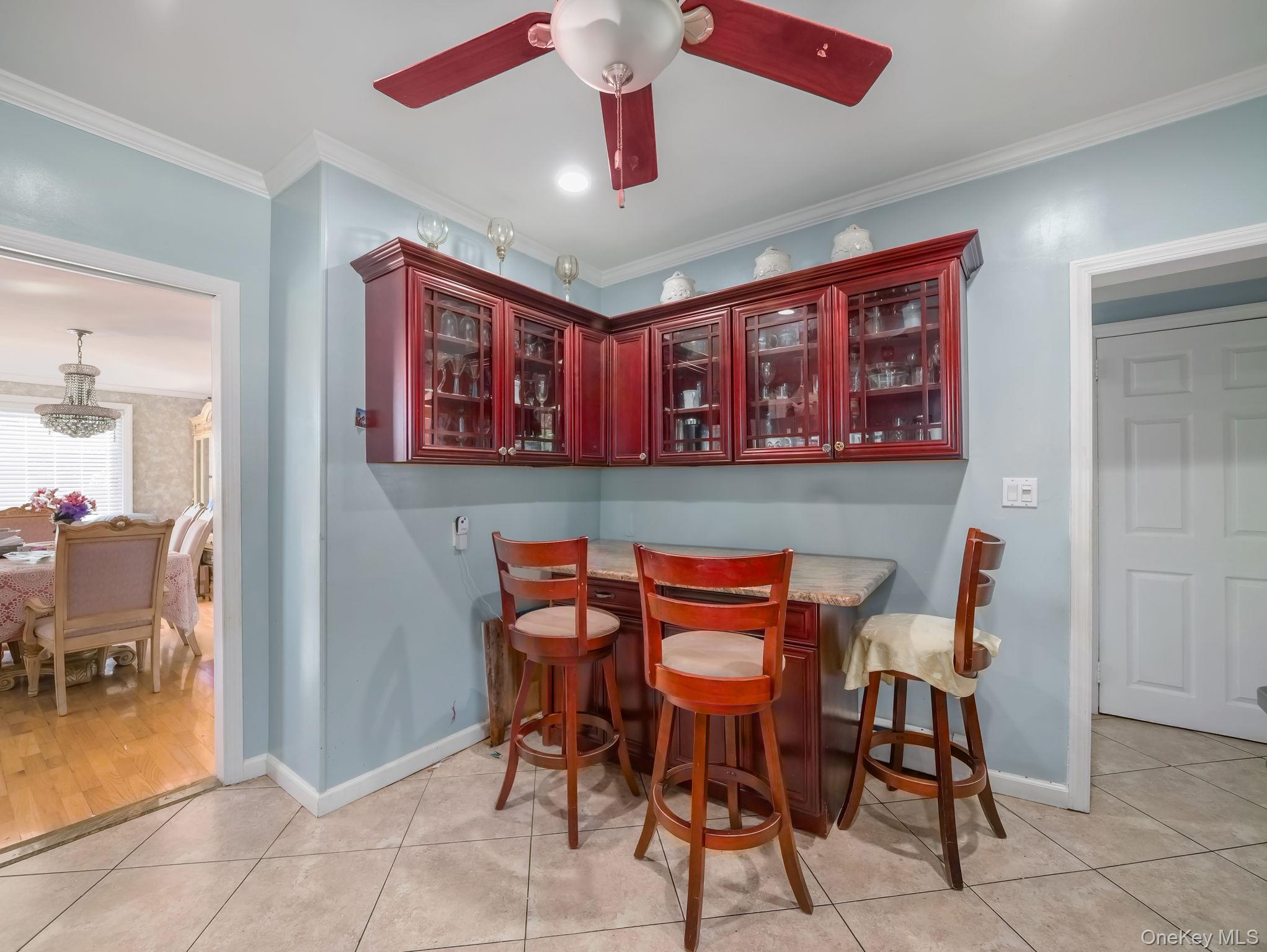 3 South Myrtle Avenue Spring Valley, NY 10977 - Photo 22 of 40 Dining room featuring ornamental molding, light tile patterned flooring, and a ceiling fan