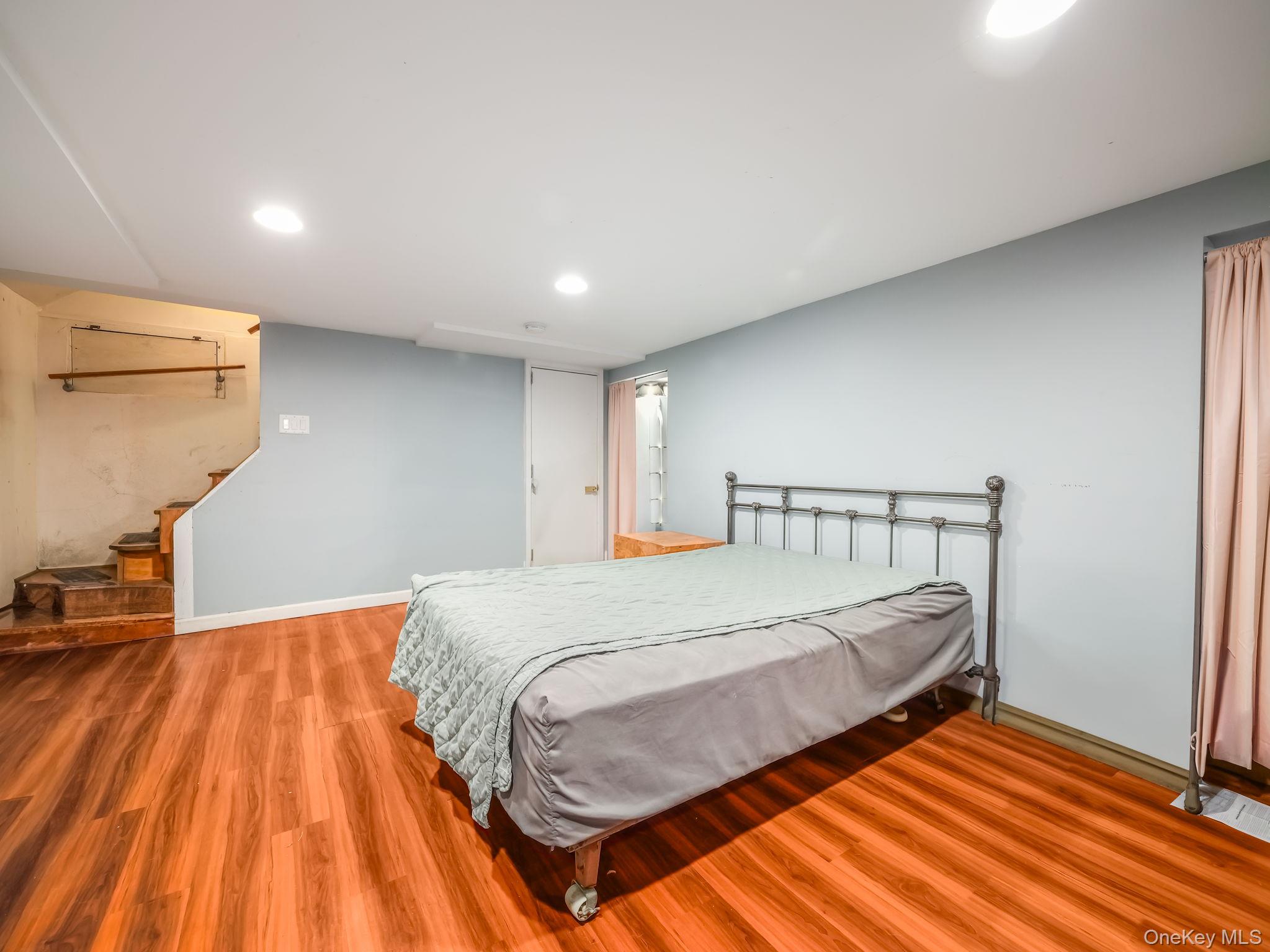 3 South Myrtle Avenue Spring Valley, NY 10977 - Photo 28 of 40 Bedroom with light wood finished floors and recessed lighting