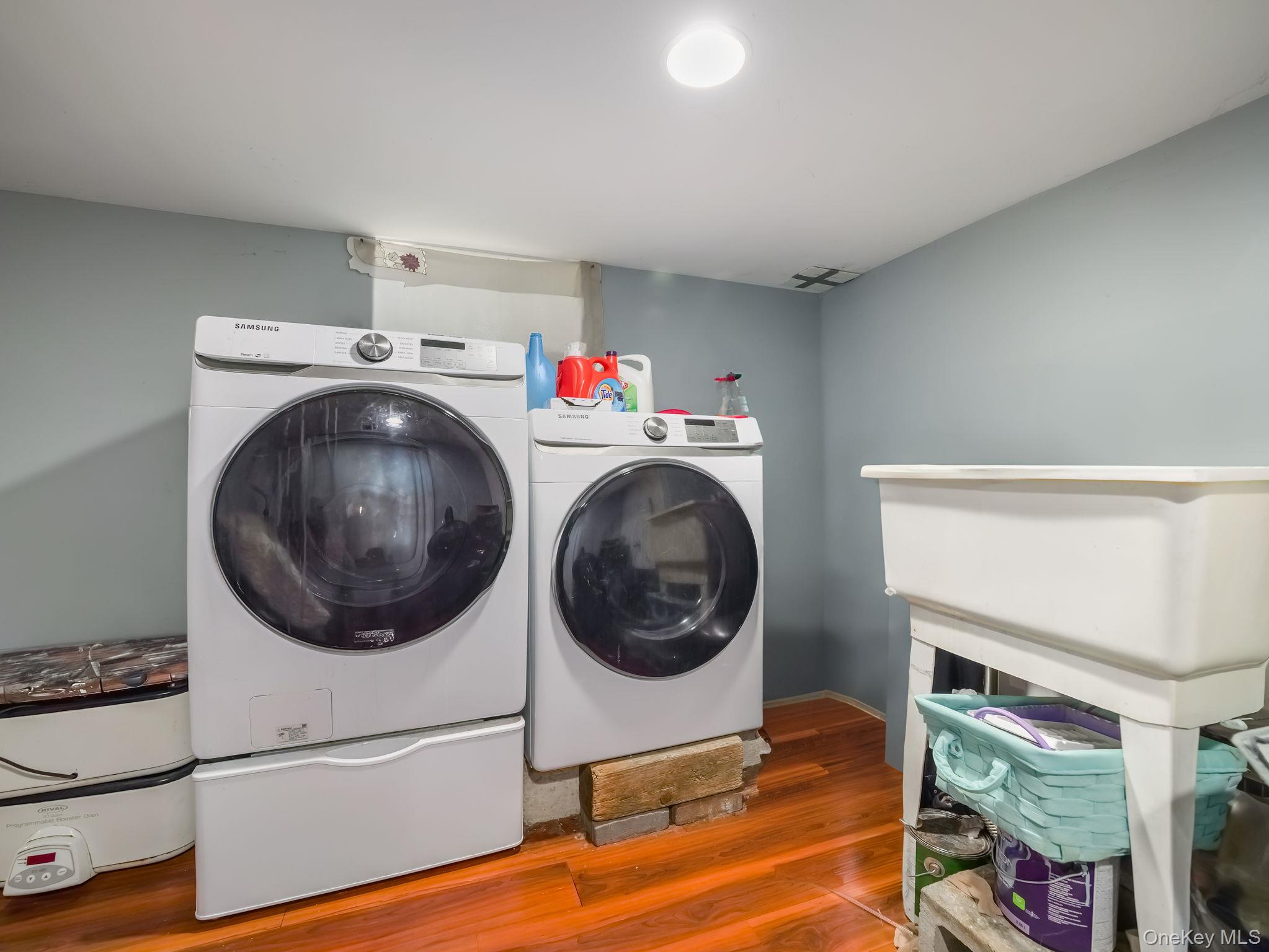 3 South Myrtle Avenue Spring Valley, NY 10977 - Photo 30 of 40 Laundry area featuring wood finished floors and separate washer and dryer