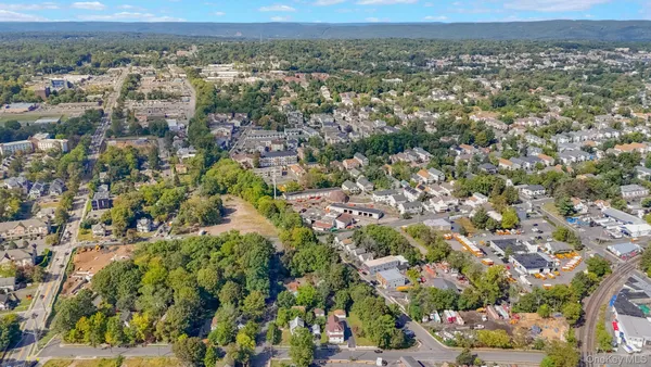 a house with yard and a wooden fence