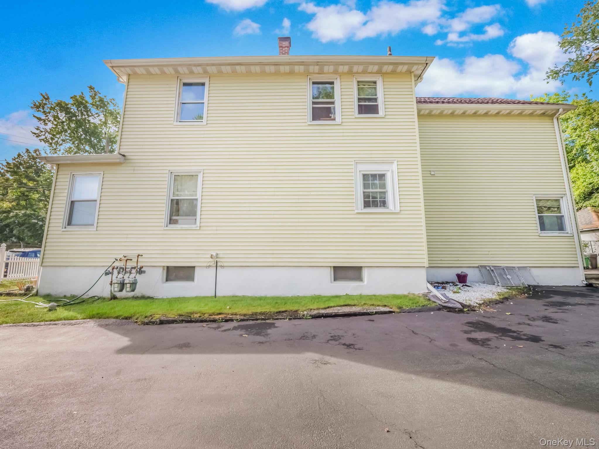 3 South Myrtle Avenue Spring Valley, NY 10977 - Photo 38 of 40 View of property exterior featuring a chimney