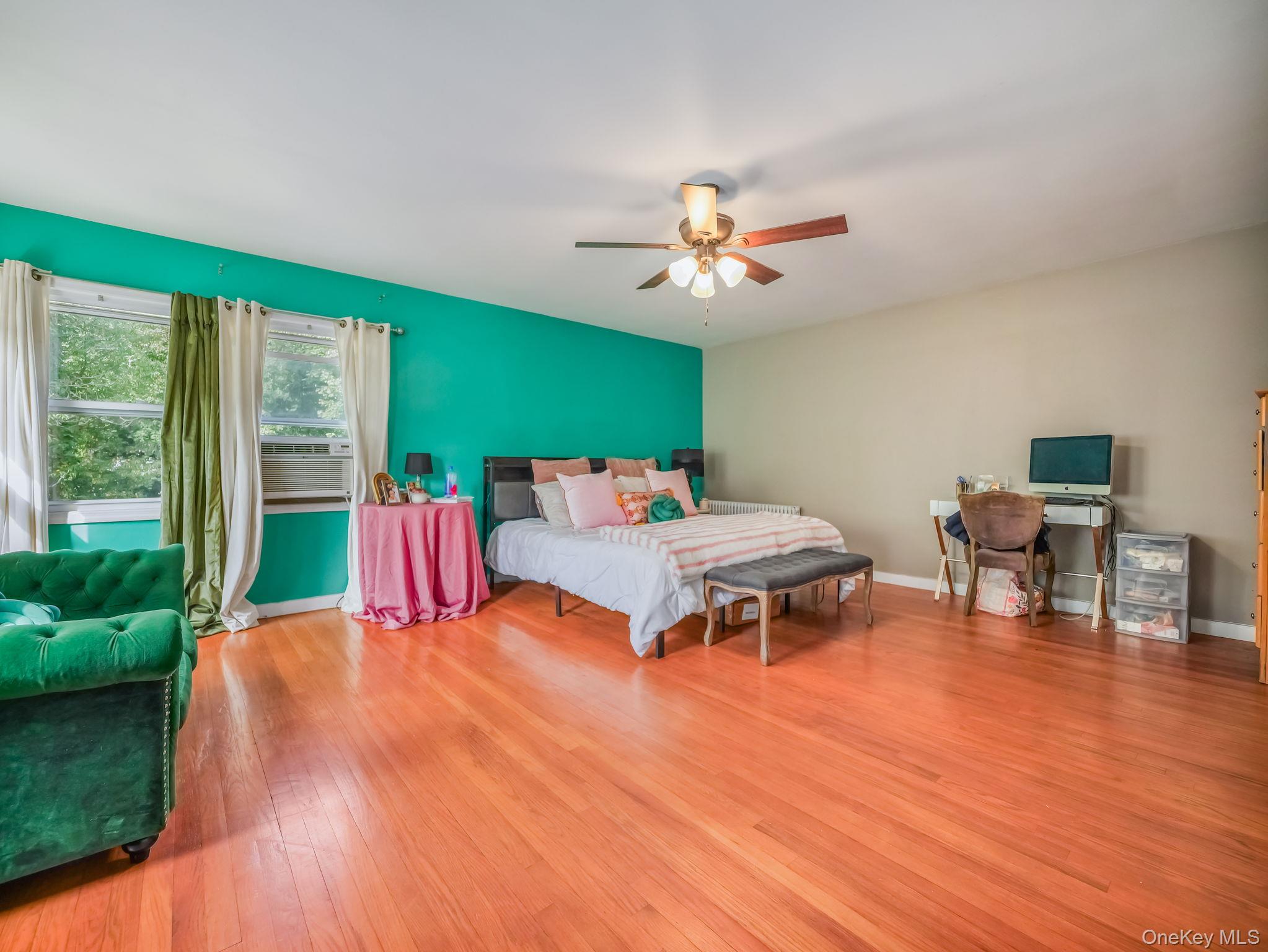 3 South Myrtle Avenue Spring Valley, NY 10977 - Photo 6 of 40 Bedroom featuring light wood finished floors, a ceiling fan, and cooling unit