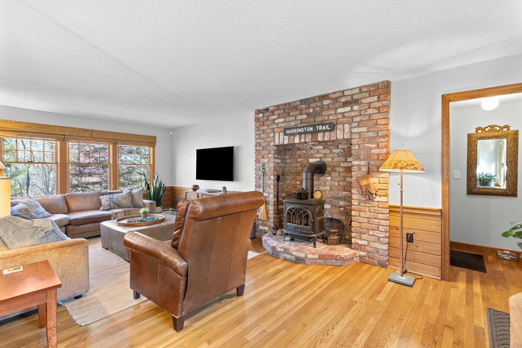 77 Forest Drive Holden, MA 01520 - Photo 13 of 27 a living room with furniture and a flat screen tv