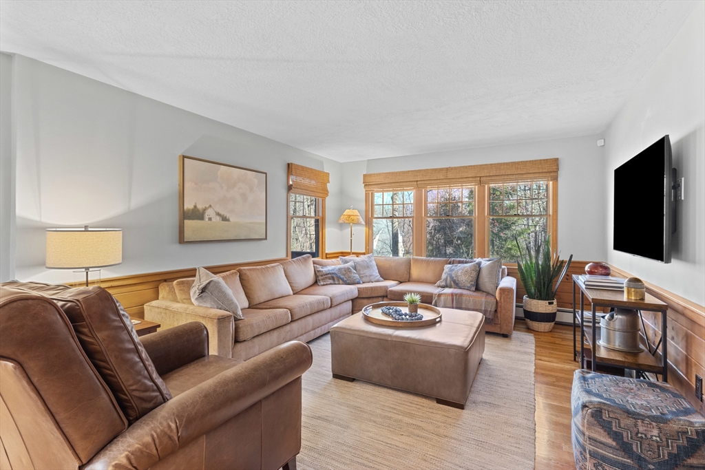 77 Forest Drive Holden, MA 01520 - Photo 14 of 27 a living room with furniture and a flat screen tv