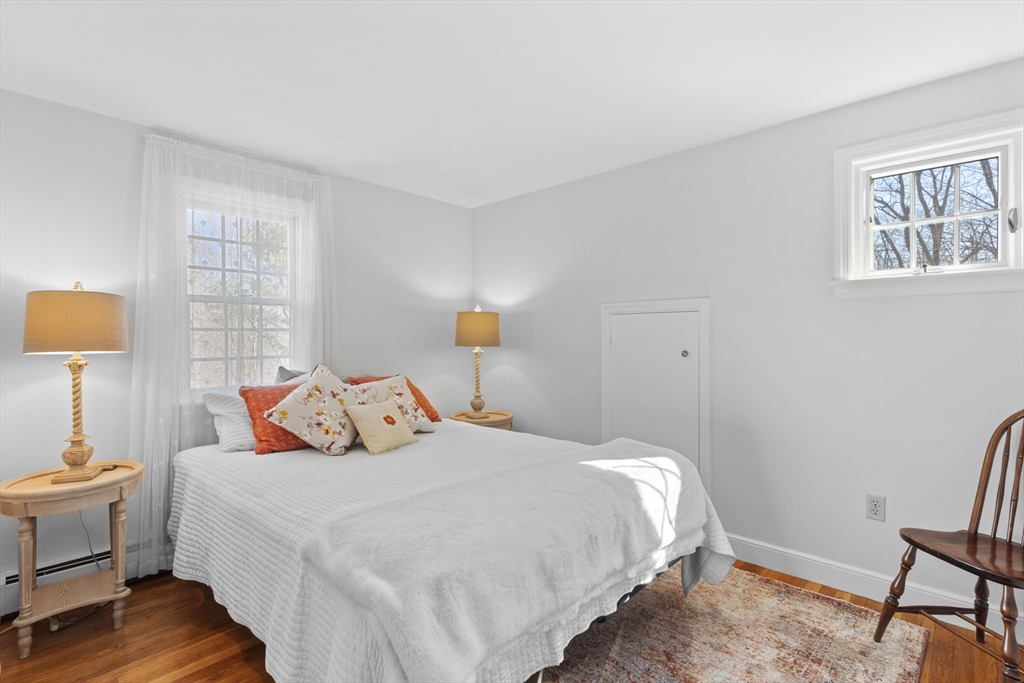 77 Forest Drive Holden, MA 01520 - Photo 20 of 27 a bedroom with a bed a lamp on desk and a window