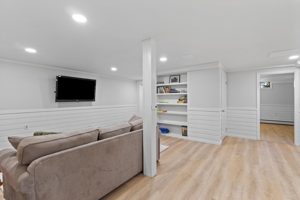 77 Forest Drive Holden, MA 01520 - Photo 24 of 27 a living room with furniture and a flat screen tv