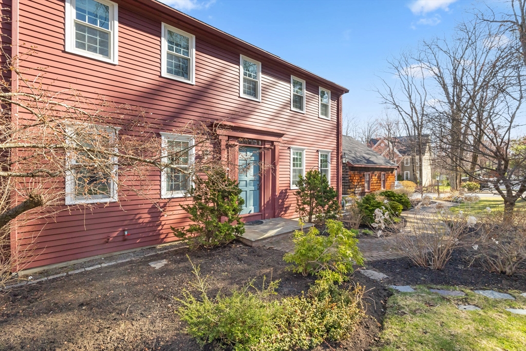 77 Forest Drive Holden, MA 01520 - Photo 4 of 27 a view of a house with yard and a garden