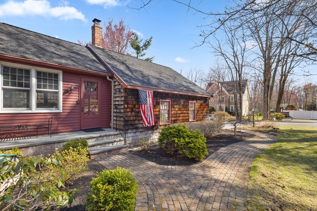 77 Forest Drive Holden, MA 01520 - Photo 5 of 27 a front view of a house with a yard