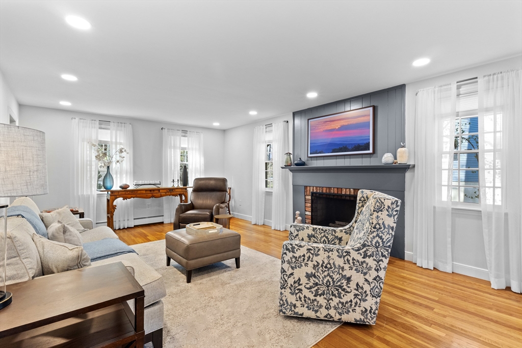 77 Forest Drive Holden, MA 01520 - Photo 7 of 27 a living room with furniture kitchen view and a fireplace