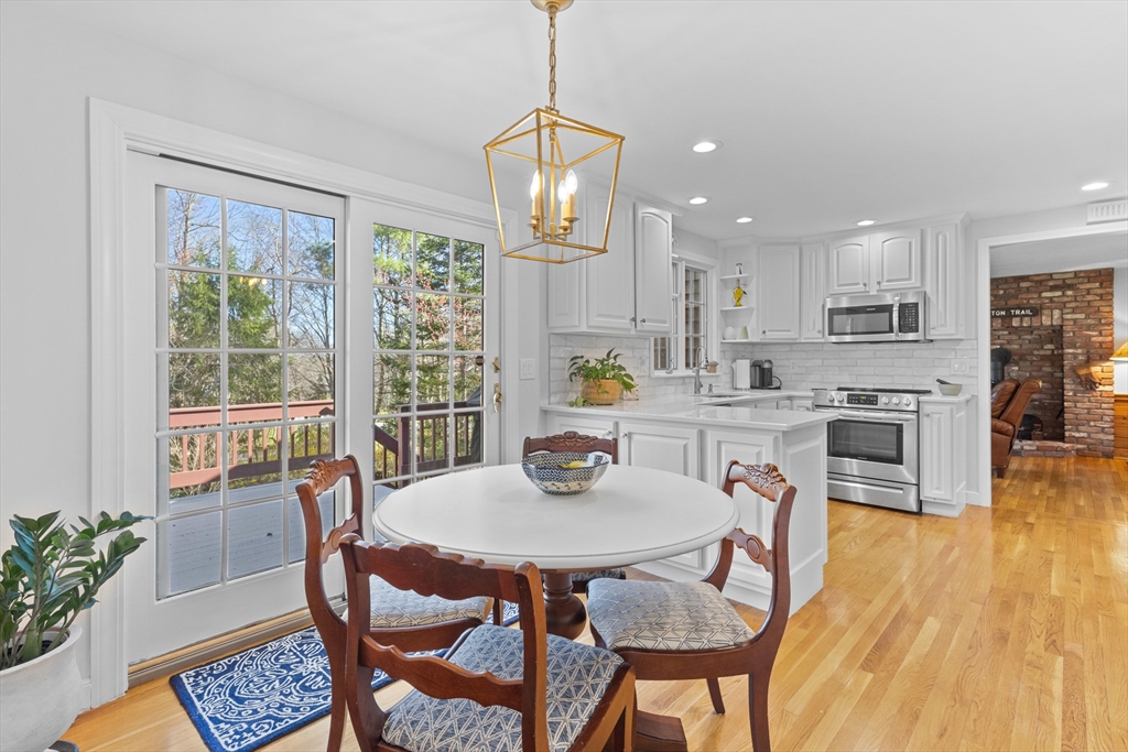 77 Forest Drive Holden, MA 01520 - Photo 8 of 27 a dining room with furniture a window and wooden floor