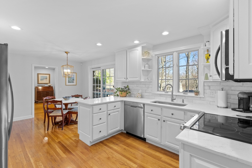 77 Forest Drive Holden, MA 01520 - Photo 9 of 27 a large white kitchen with lots of counter top space and furniture