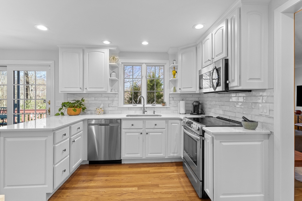 77 Forest Drive Holden, MA 01520 - Photo 10 of 27 a kitchen with stainless steel appliances granite countertop a sink and cabinets