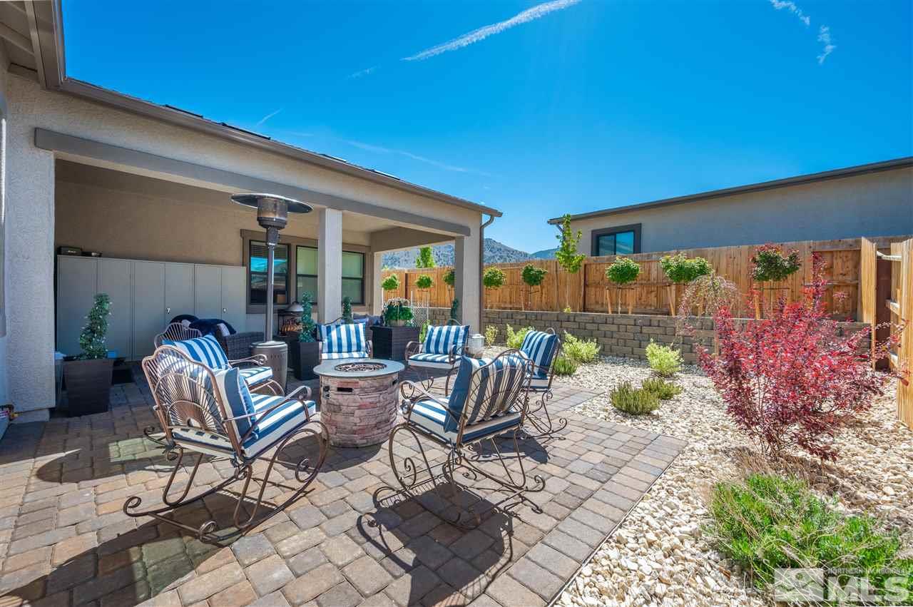 2522 Titanium Crest Drive Reno, NV 89521 - Photo 22 of 23 a view of a patio with table and chairs and potted plants