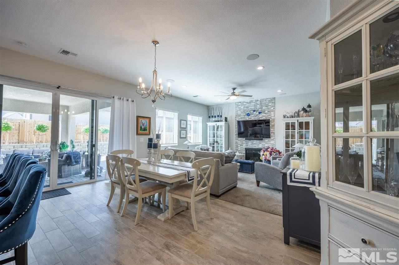 2522 Titanium Crest Drive Reno, NV 89521 - Photo 4 of 23 a view of a dining room with furniture window and wooden floor