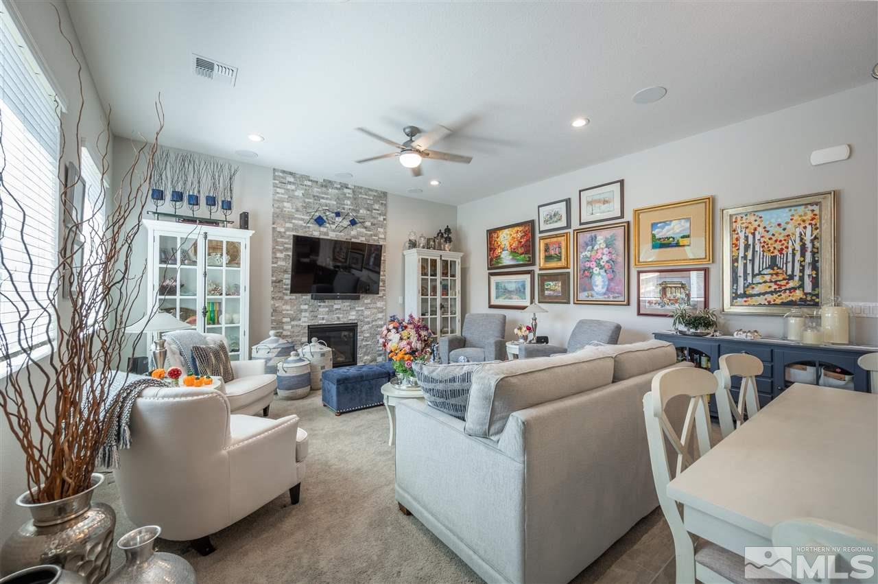 2522 Titanium Crest Drive Reno, NV 89521 - Photo 8 of 23 a living room with furniture flat screen tv and large window