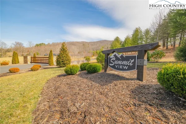 a view of a street with a building in the background