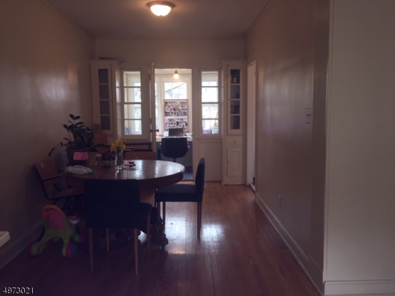 33 Hillside Avenue, Unit 2 Montclair, NJ 07042 - Photo 3 of 8 a dining room with furniture and window