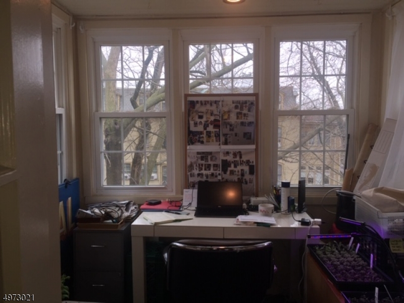 33 Hillside Avenue, Unit 2 Montclair, NJ 07042 - Photo 6 of 8 a view of a workspace with furniture and a window