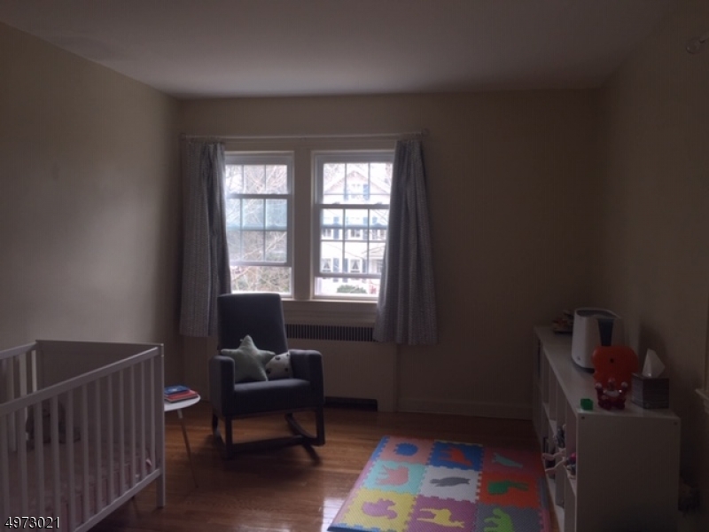 33 Hillside Avenue, Unit 2 Montclair, NJ 07042 - Photo 8 of 8 a living room with furniture and a window