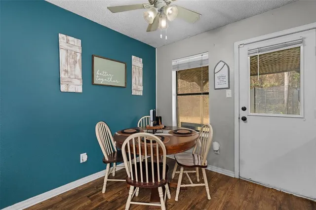 a dining room with furniture and window