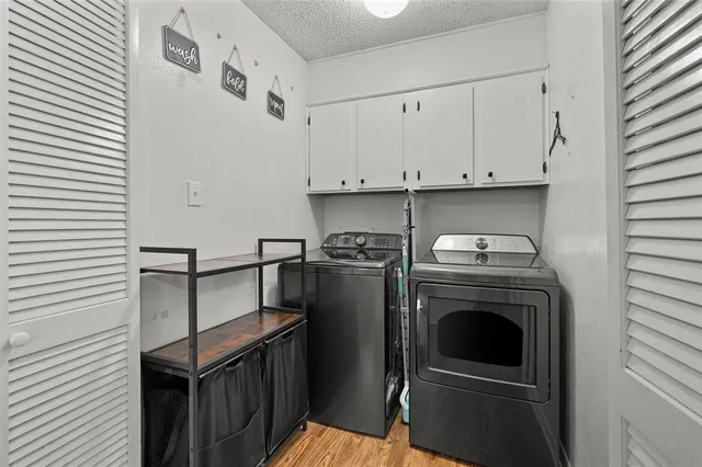 a view of a kitchen with washer and dryer