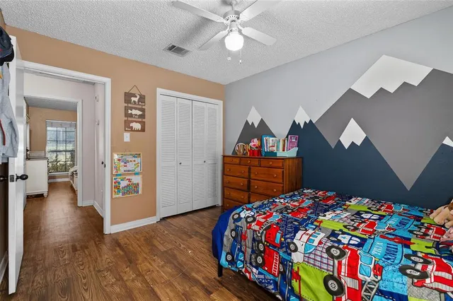 a bathroom with a sink mirror vanity and toilet