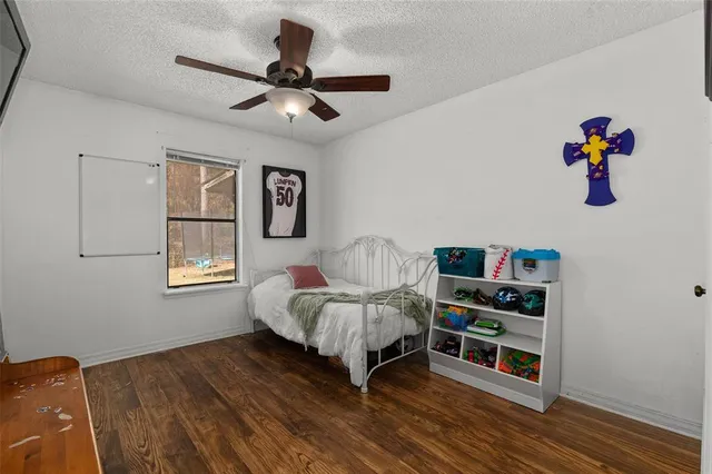 a swimming pool with outdoor seating and garden