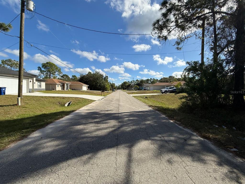 3315 24th Street West Lehigh Acres, FL 33971 - Photo 4 of 7 a view of a yard with swimming pool