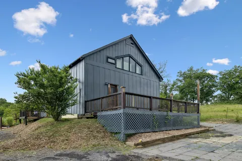 a front view of a house with a fence