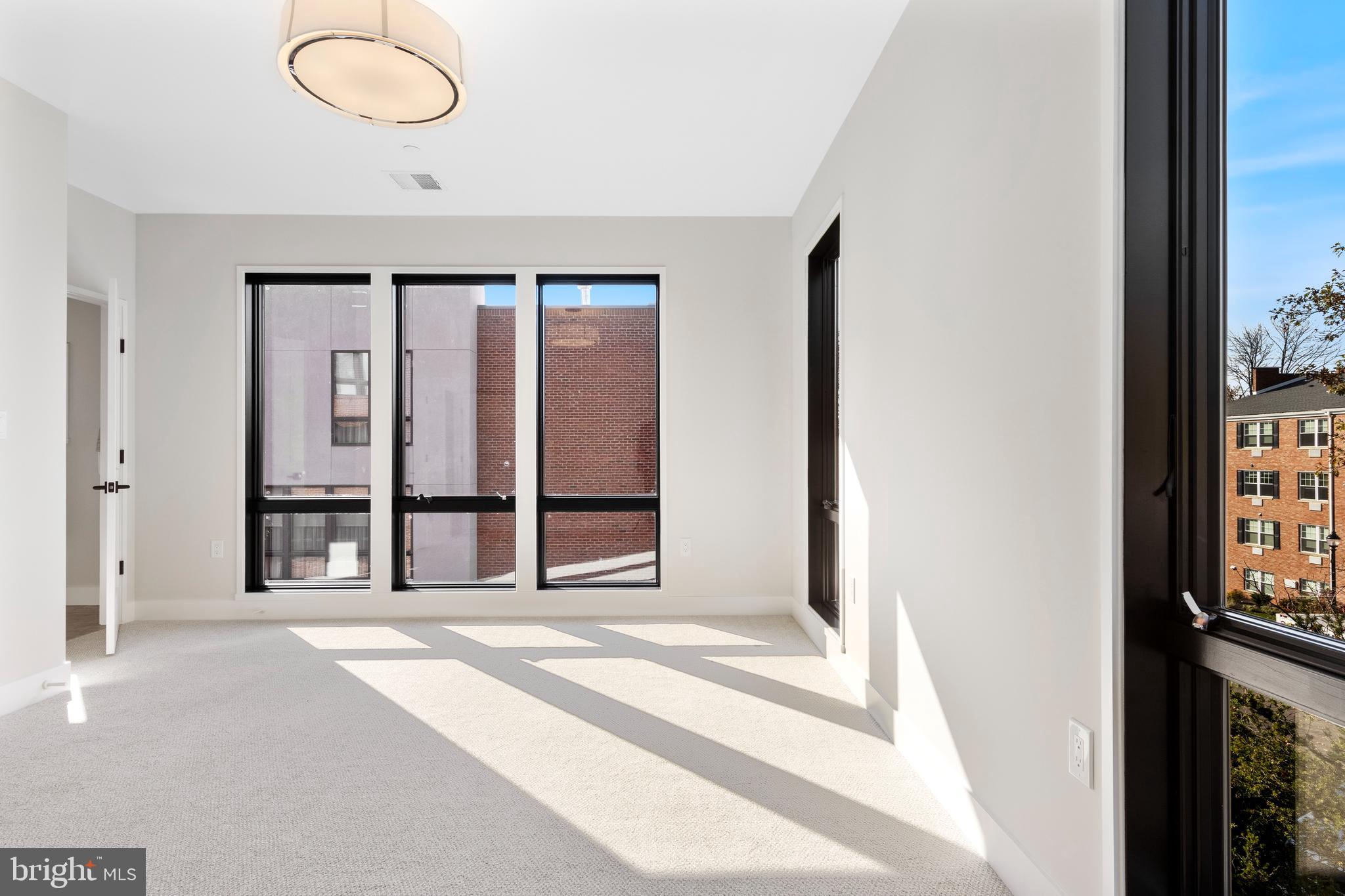 427 East Lancaster Avenue, Unit 2201 Wayne, PA 19087 - Photo 40 of 46 a view of a room with large windows and cabinet