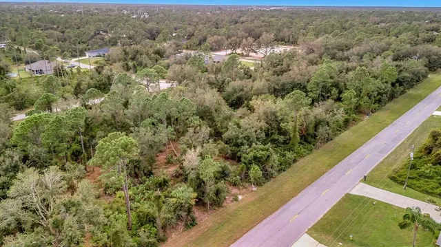 a view of a yard with an outdoor seating