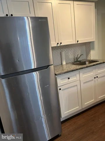 a view of cabinets and wooden floor