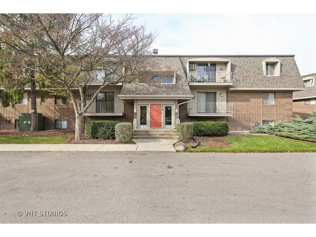 214 East Bailey Road, Unit A Naperville, IL 60565 - Photo 1 of 10 a front view of a house with a yard and a garage