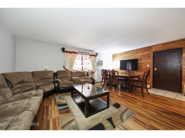 214 East Bailey Road, Unit A Naperville, IL 60565 - Photo 3 of 10 a living room with furniture and a wooden floor
