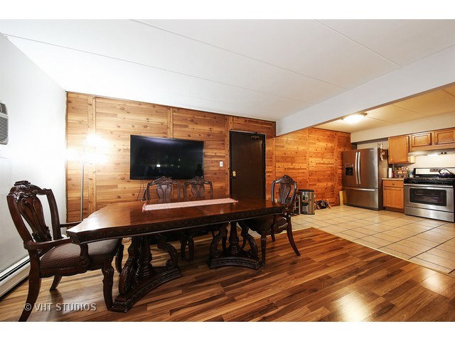214 East Bailey Road, Unit A Naperville, IL 60565 - Photo 5 of 10 a view of a dining room with furniture and wooden floor