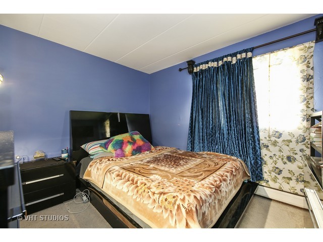 214 East Bailey Road, Unit A Naperville, IL 60565 - Photo 6 of 10 a bedroom with a bed and a window