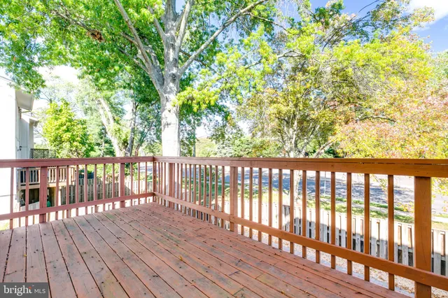 a view of balcony with wooden floor