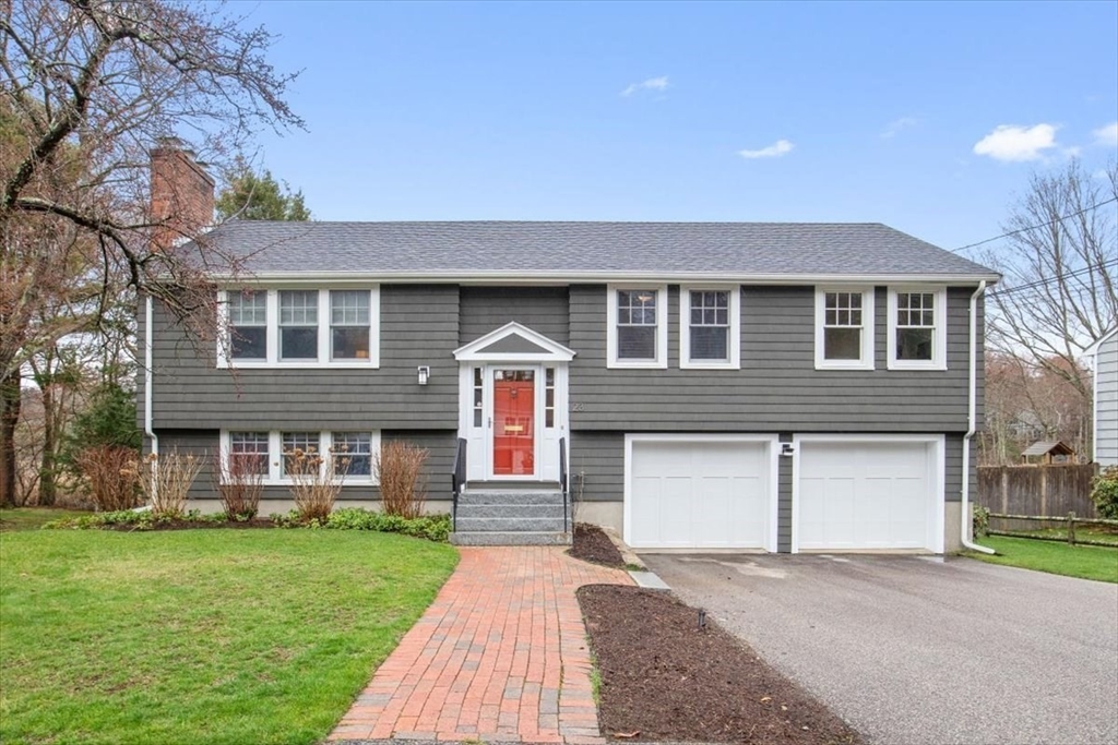 front view of a house with a yard