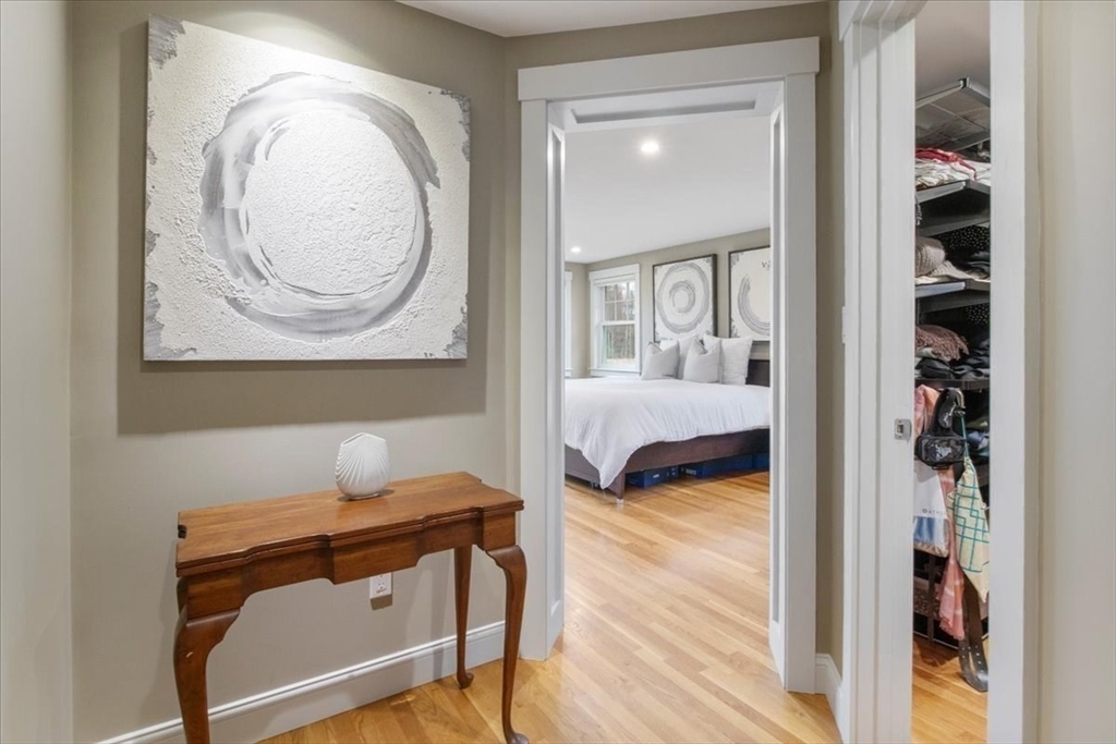 23 Glover Road Needham, MA 02494 - Photo 20 of 40 a bedroom with a bed and a mirror
