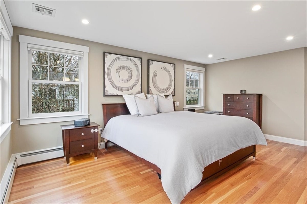 23 Glover Road Needham, MA 02494 - Photo 21 of 40 a bedroom with a bed and a large window