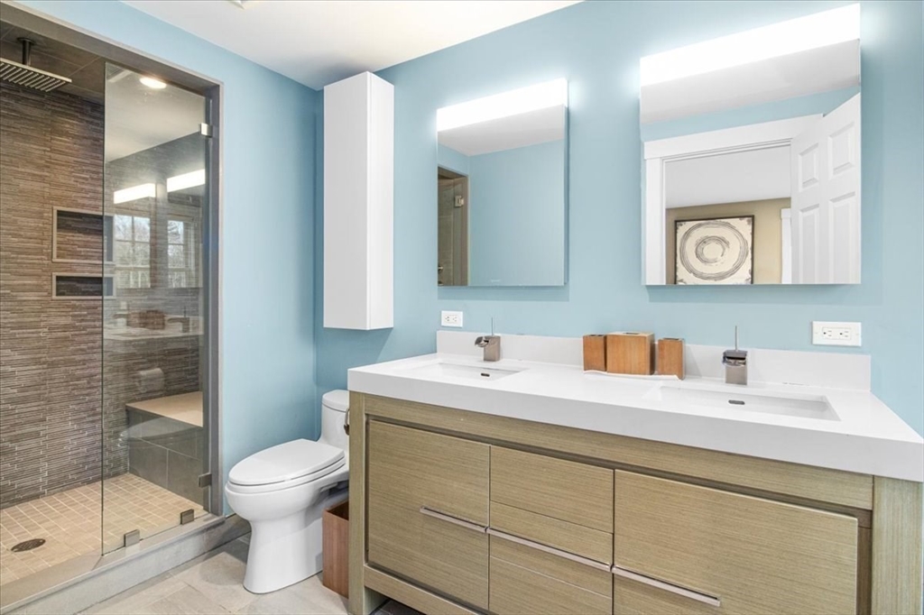 23 Glover Road Needham, MA 02494 - Photo 24 of 40 a bathroom with a sink toilet and shower