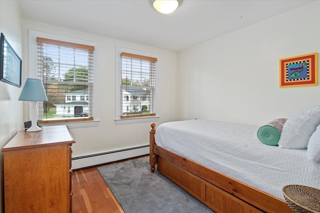 23 Glover Road Needham, MA 02494 - Photo 29 of 40 a bedroom with a bed and a window