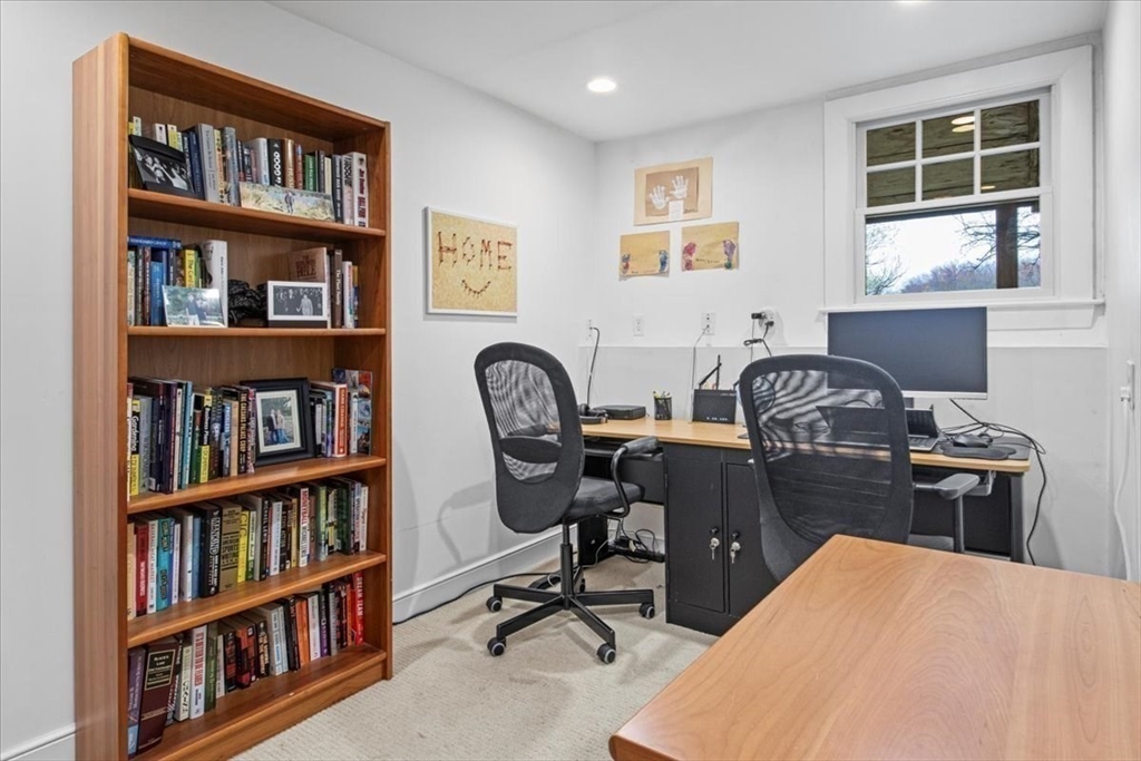 23 Glover Road Needham, MA 02494 - Photo 31 of 40 a view of a workspace with a bookshelf