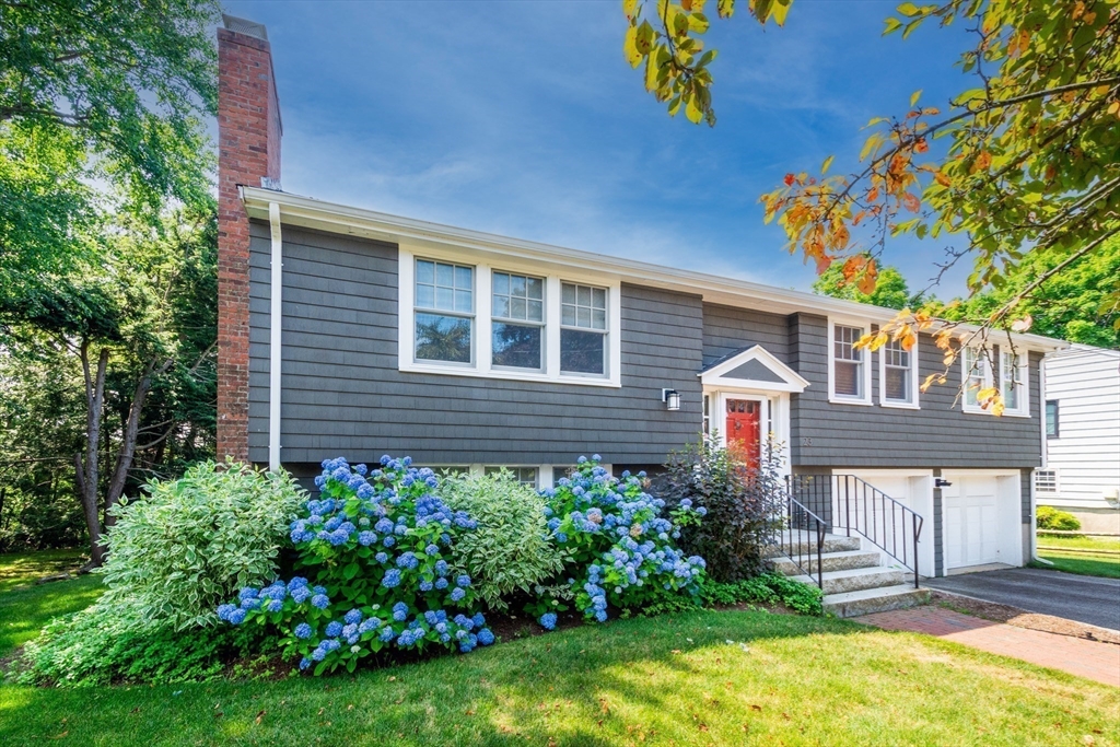 23 Glover Road Needham, MA 02494 - Photo 4 of 40 a front view of a house with a yard
